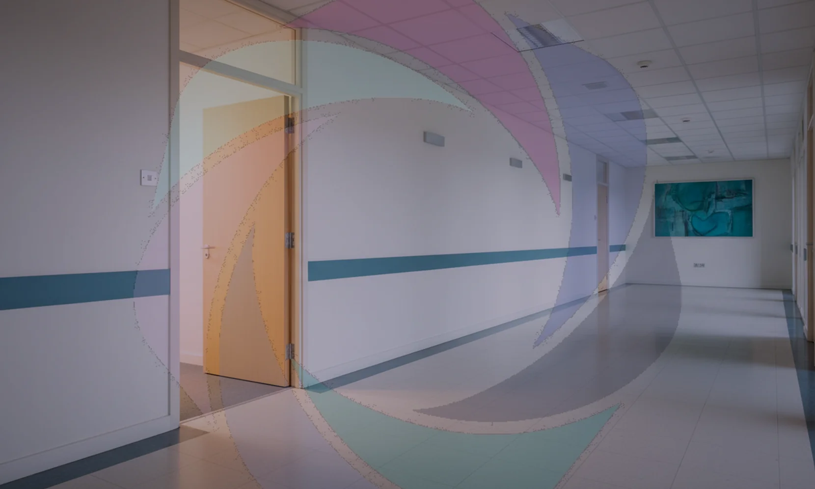 Manager talking with an employee in an office corridor, a quiet one-to-one workplace conversation